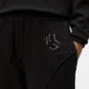 Nastoitettu monogrammi-verkkarihousut Nastoitettu monogrammi-verkkarihousut