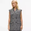Paljettikoristeltu tweed-liivi Paljettikoristeltu tweed-liivi
